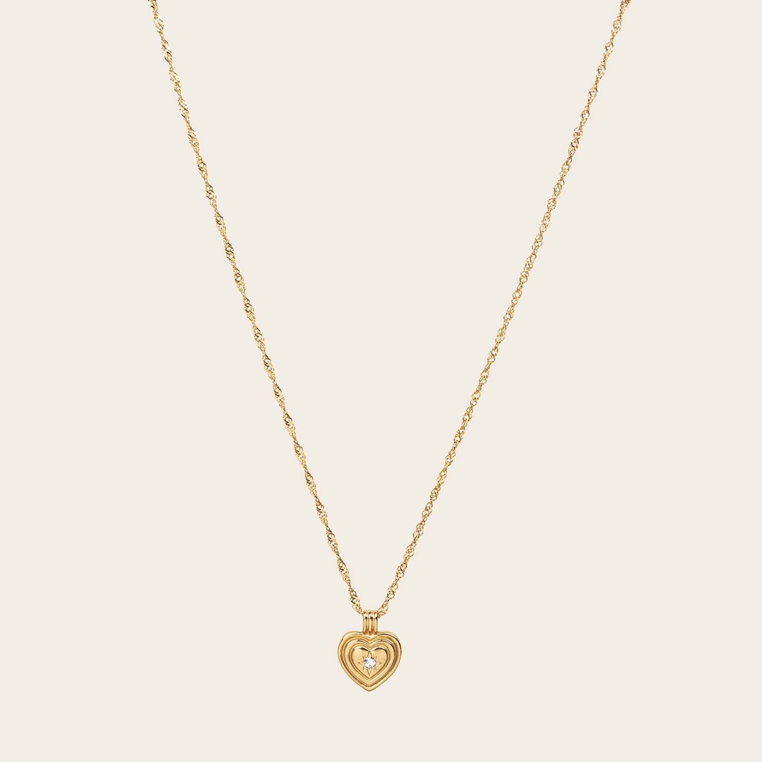 Image of the Ellie Heart Pendant Necklace is crafted from 14K Gold Plated Stainless Steel and embellished with Cubic Zirconia. It is adjustable and non-tarnish with great water and allergy resistance.