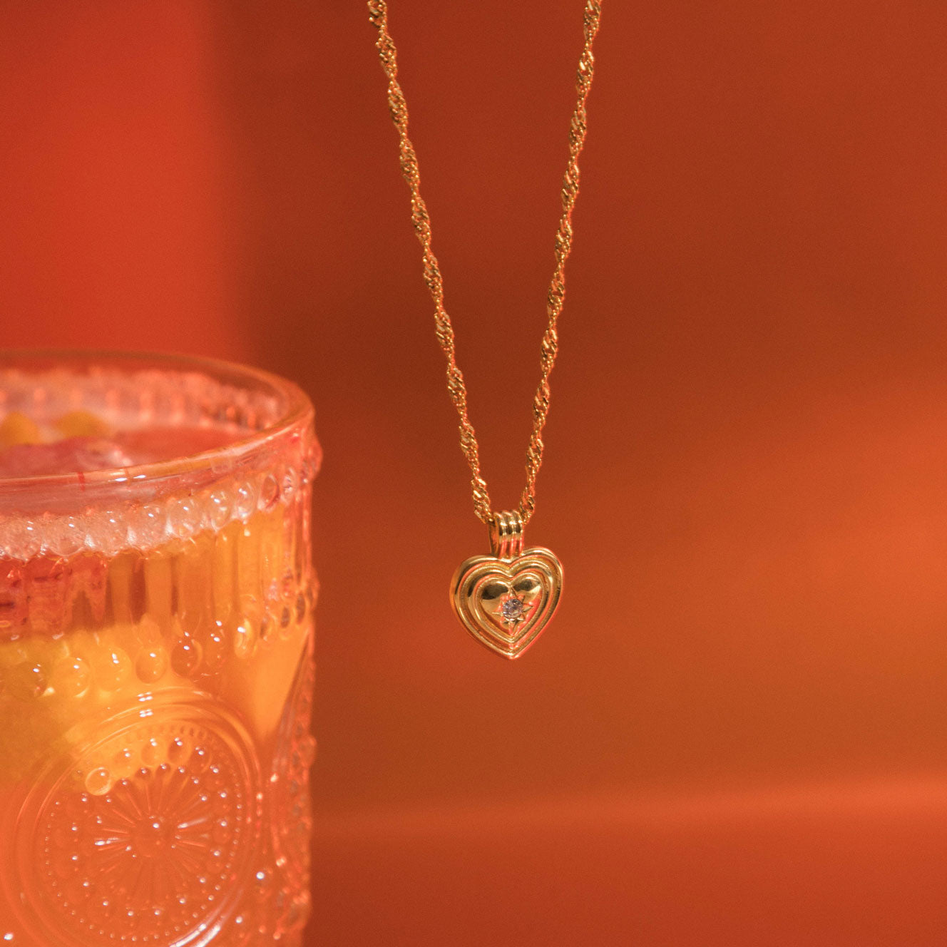 Image of the Ellie Heart Pendant Necklace is crafted from 14K Gold Plated Stainless Steel and embellished with Cubic Zirconia. It is adjustable and non-tarnish with great water and allergy resistance.