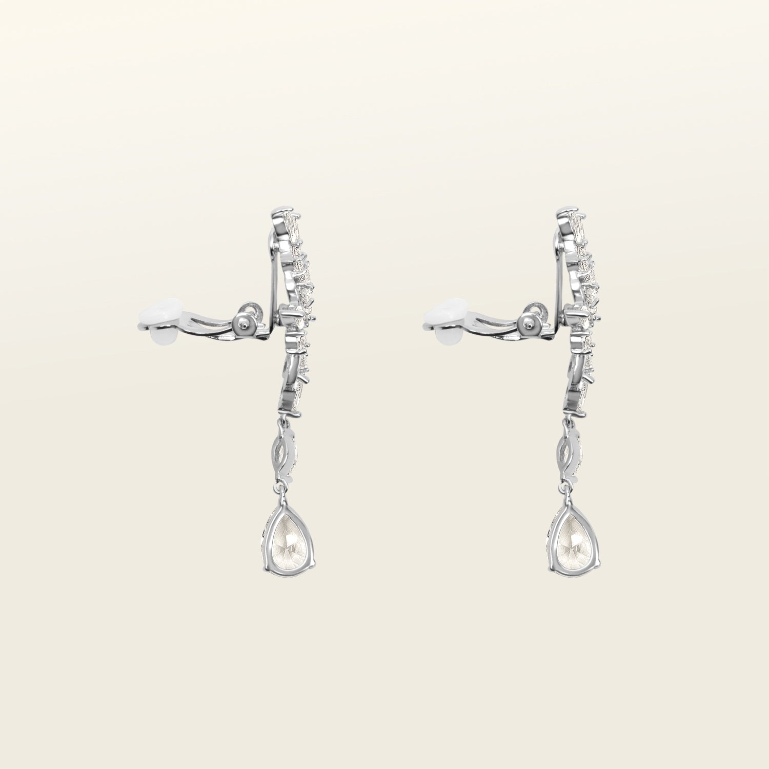 Image of the Evelyn Clip-On Earrings offer a secure fit for all ear types, ranging from thick/large ears to small/thin ears. With an average comfortable wear duration of 8-12 hours, these earrings have silver plated copper alloy components and feature a cubic zirconia setting. Additionally, the rubber padding is removable. Please note that this item is one pair.