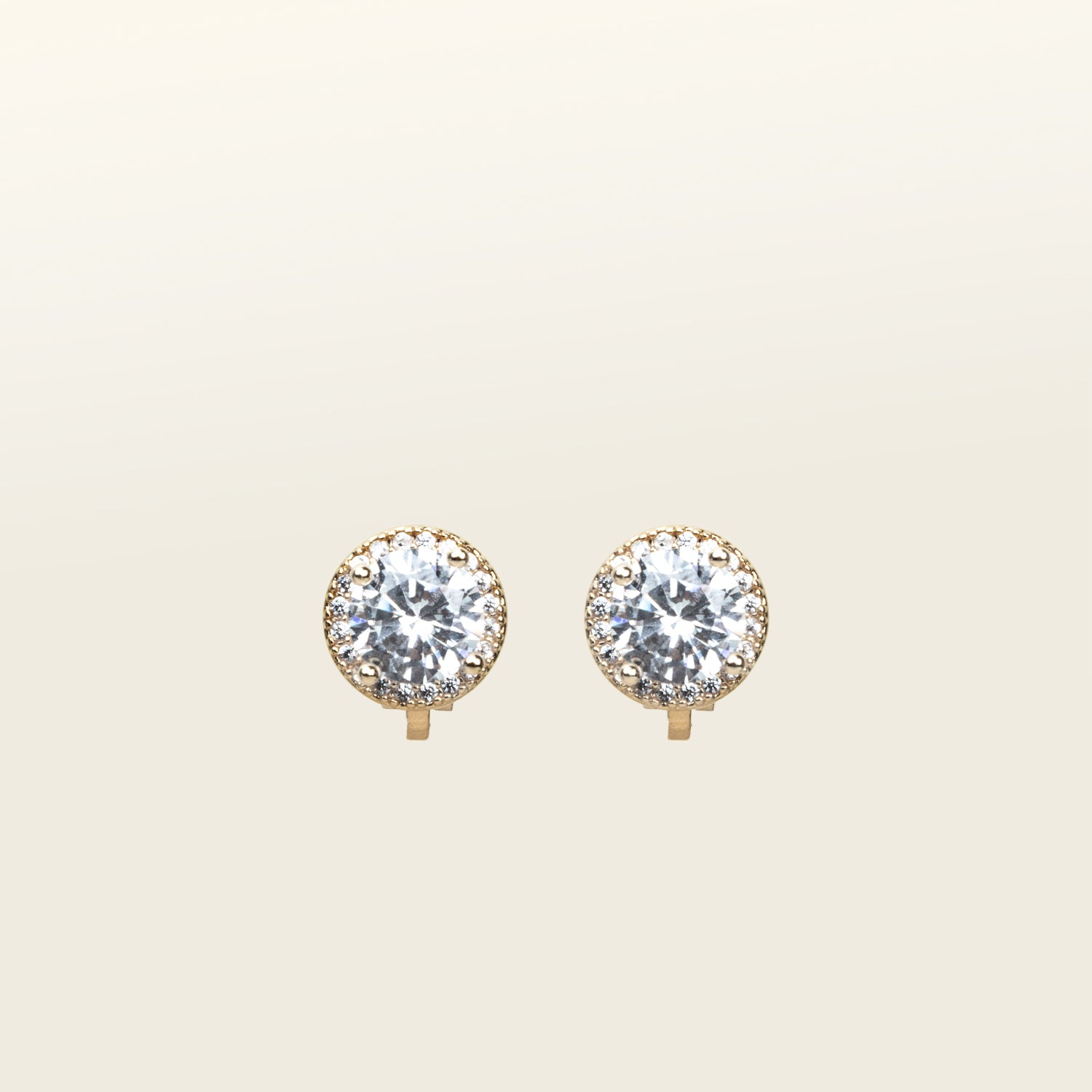 Image of the Harper Stud Clip On Earrings in Gold are ideal for any ear type, offering a secure hold for up to 12 hours of comfortable wear. Crafted from gold tone copper alloy and Cubic Zirconia, the earrings feature a padded clip-on closure and removable rubber padding. Please note the item is for one pair only.