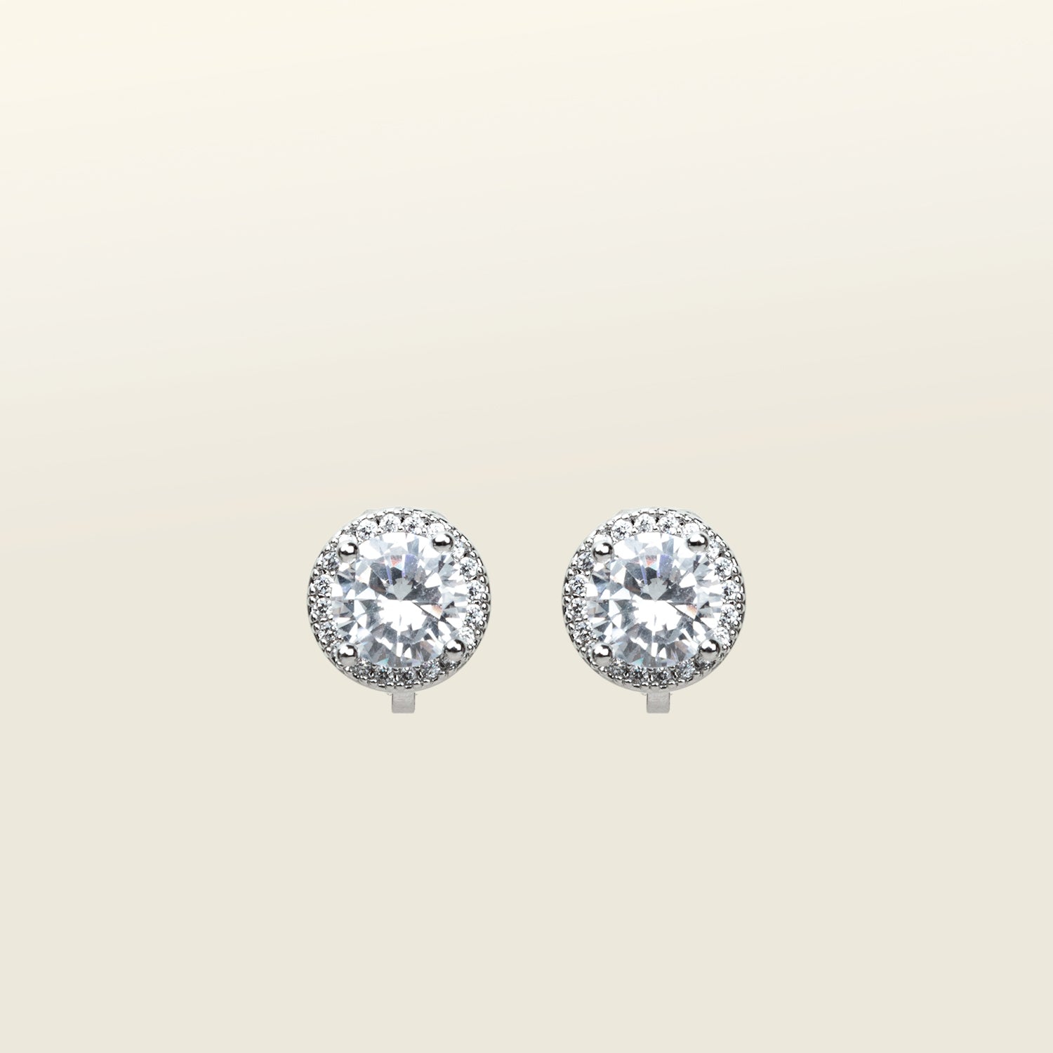 Image of the Harper Stud clip-on earrings features a secure hold, with a maximum comfortable wear duration of 8 to 12 hours. It is ideal for all ear types, including thick/large, sensitive, small/thin, and stretched/healing types. It is made with a silver-tone copper alloy and cubic zirconia, and comes with a removable rubber padding for added comfort. Please note: only one pair is included.