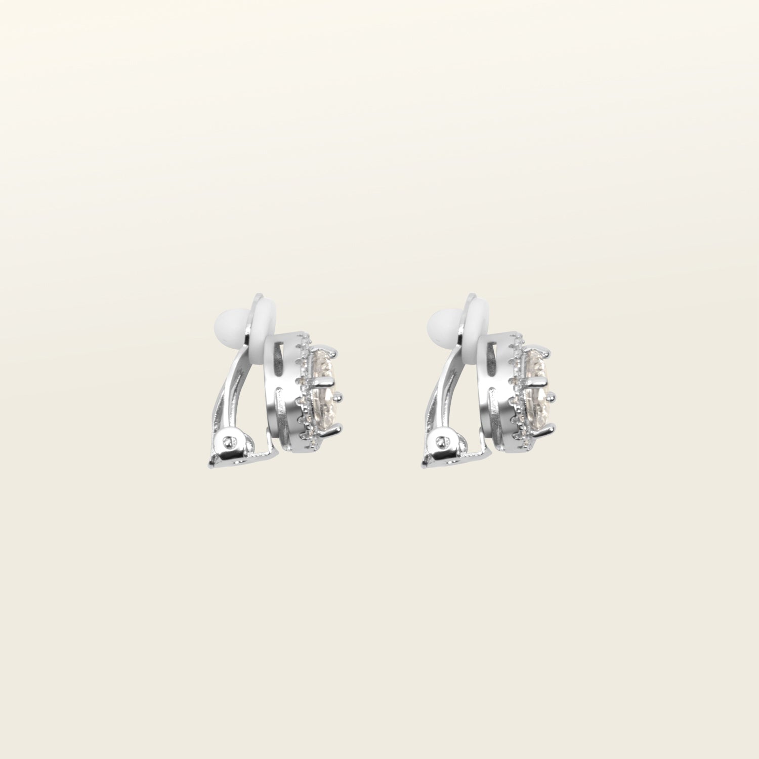 Image of the Harper Stud clip-on earrings features a secure hold, with a maximum comfortable wear duration of 8 to 12 hours. It is ideal for all ear types, including thick/large, sensitive, small/thin, and stretched/healing types. It is made with a silver-tone copper alloy and cubic zirconia, and comes with a removable rubber padding for added comfort. Please note: only one pair is included.