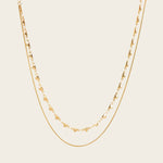 Image of the Heart Chain Double Layered Necklace is crafted from 14K Gold Plated Stainless Steel, which is water resistant and non-tarnishing. The necklace can be adjusted for a perfect fit. Please Note: This product is one necklace.