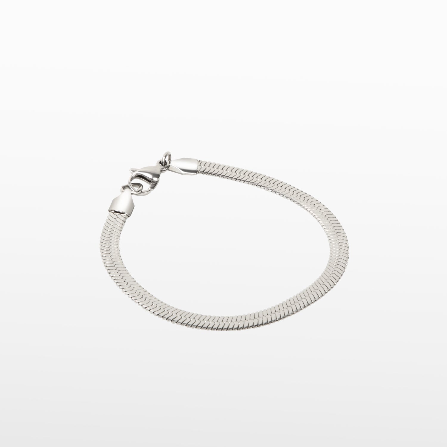Image of the Herringbone Chain Bracelet in Silver is crafted with stainless steel and measures 18cm long and 5mm wide. It is also non-tarnish and water resistant.