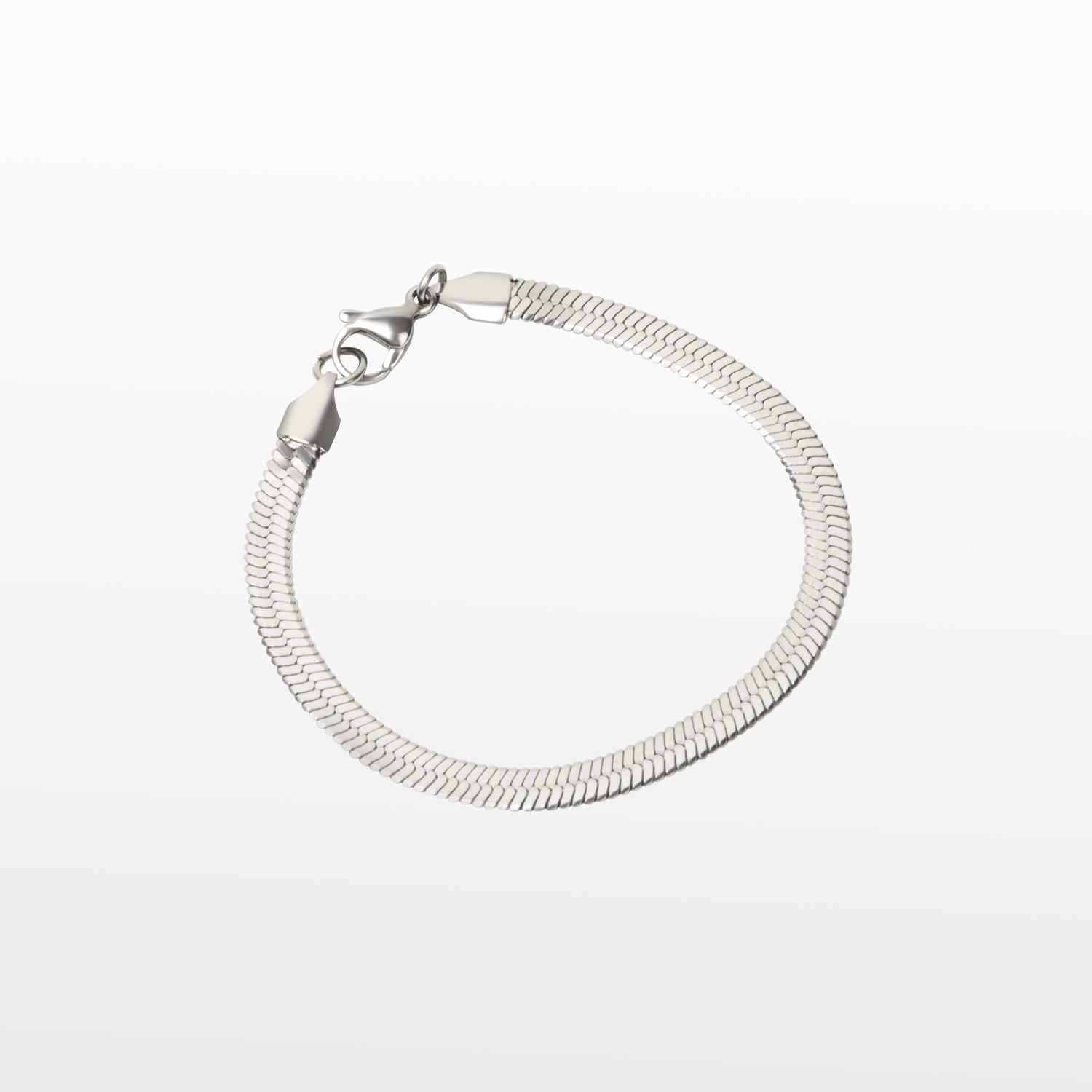 Image of the Herringbone Chain Bracelet in Silver is crafted with stainless steel and measures 18cm long and 5mm wide. It is also non-tarnish and water resistant.