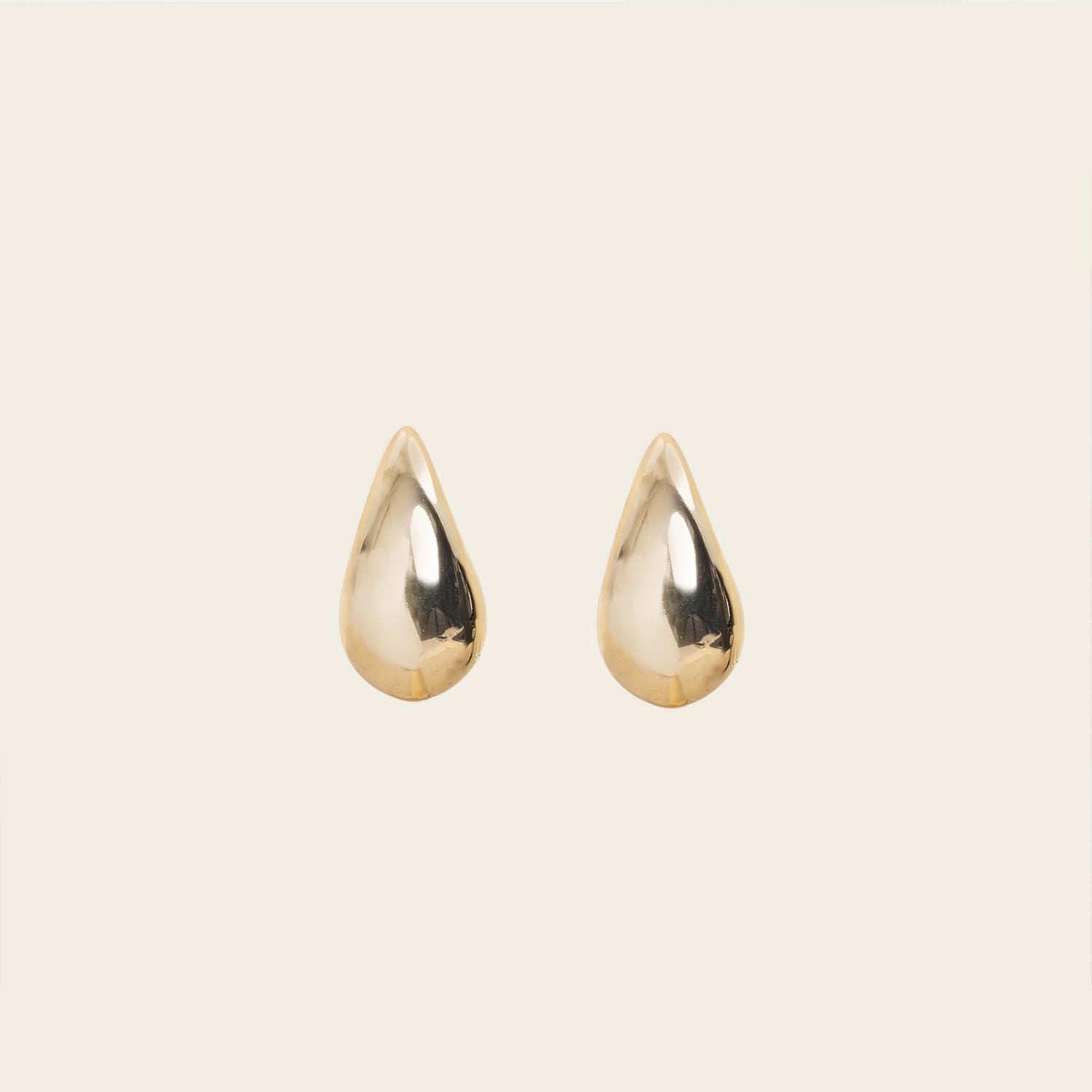 Image of the Isla Clip On Earrings in Gold feature a secure screwback closure that fits all ear types, providing an average comfortable wear duration of 8 - 12 hours. The hold strength is strong and you can manually adjust the earrings to your ear size. Constructed of gold toned copper alloy, this item is a single pair.
