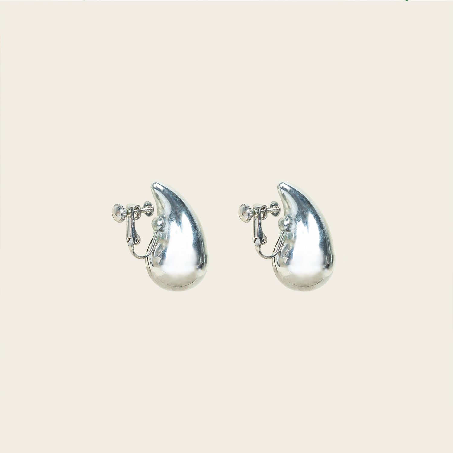 Image of the Isla Clip On Earrings in Silver feature a screwback closure that makes them suitable for all ear types, providing a secure hold for up to 12 hours. Easily adjustable, these earrings are constructed with a silver toned copper alloy. Please note: this item is sold as one pair.