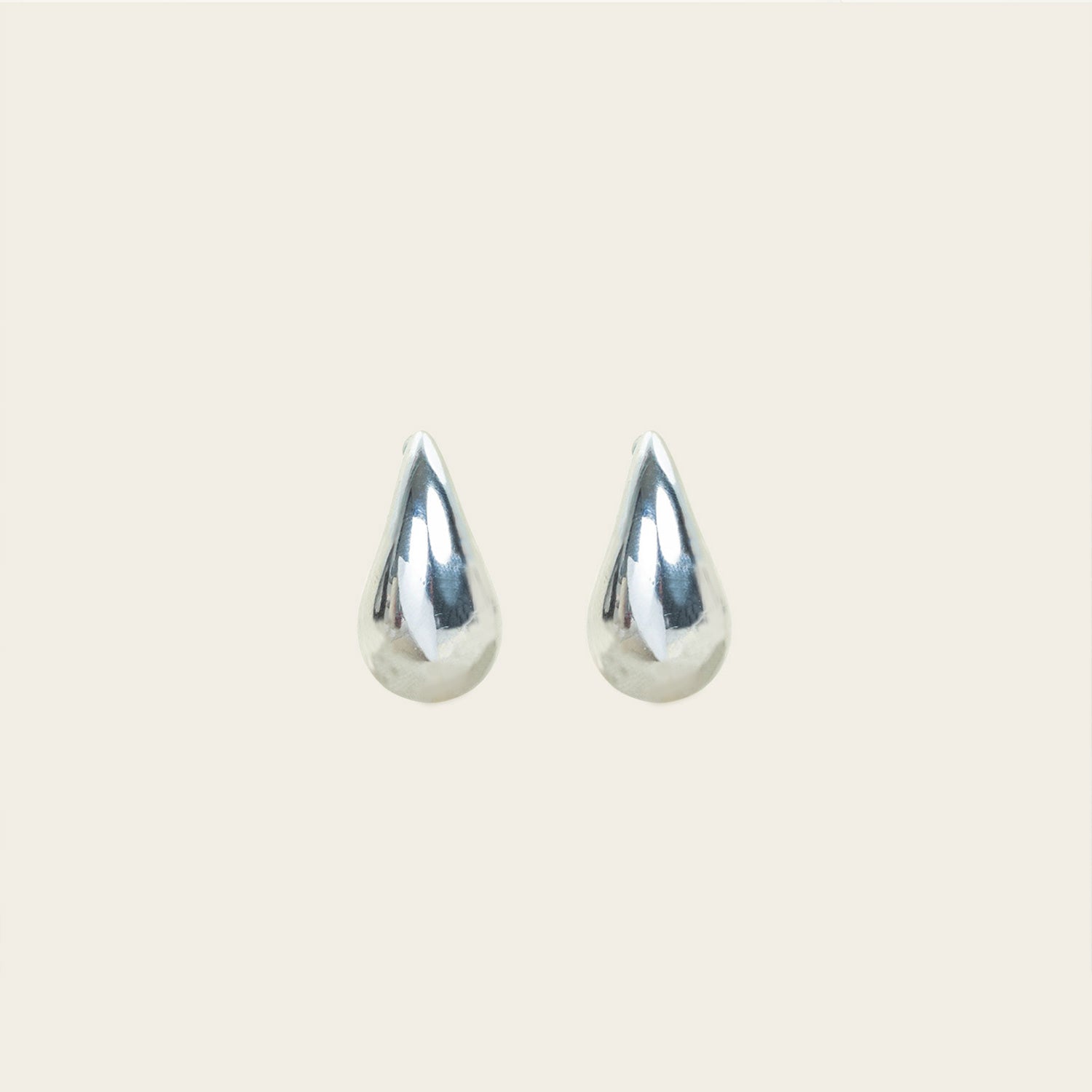 Image of the Isla Clip On Earrings in Silver feature a screwback closure that makes them suitable for all ear types, providing a secure hold for up to 12 hours. Easily adjustable, these earrings are constructed with a silver toned copper alloy. Please note: this item is sold as one pair.