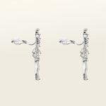 Image of the Lobelia Clip-On Earrings feature a secure, comfortable hold that lasts for 8-12 hours. Attached to silver-plated metal alloy, these earrings are fitted with foam padding for optimal comfort and ease-of-use. Ideal for all ear types, from thin/small to thick/large, along with sensitive ears and those in the healing/stretching process. Cubic Zirconia adds a hint of sparkle. Please note, item includes one pair of earrings.
