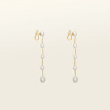 Image of the Lune Pearl Clip-On Earrings in Gold feature a unique, secure mosquito coil clasp. They are ideal for all ear types, from thick and large ears to sensitive and small. With medium hold strength, the earrings can be comfortably worn up to 24 hours and easily adjusted. Crafted with freshwater pearls, each pair may display natural variations in size and color. Materials include freshwater pearl and 18K gold-plated stainless steel.