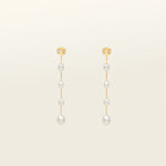 Image of the Lune Pearl Clip-On Earrings in Gold feature a unique, secure mosquito coil clasp. They are ideal for all ear types, from thick and large ears to sensitive and small. With medium hold strength, the earrings can be comfortably worn up to 24 hours and easily adjusted. Crafted with freshwater pearls, each pair may display natural variations in size and color. Materials include freshwater pearl and 18K gold-plated stainless steel.