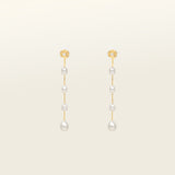 Image of the Lune Pearl Clip-On Earrings in Gold feature a unique, secure mosquito coil clasp. They are ideal for all ear types, from thick and large ears to sensitive and small. With medium hold strength, the earrings can be comfortably worn up to 24 hours and easily adjusted. Crafted with freshwater pearls, each pair may display natural variations in size and color. Materials include freshwater pearl and 18K gold-plated stainless steel.