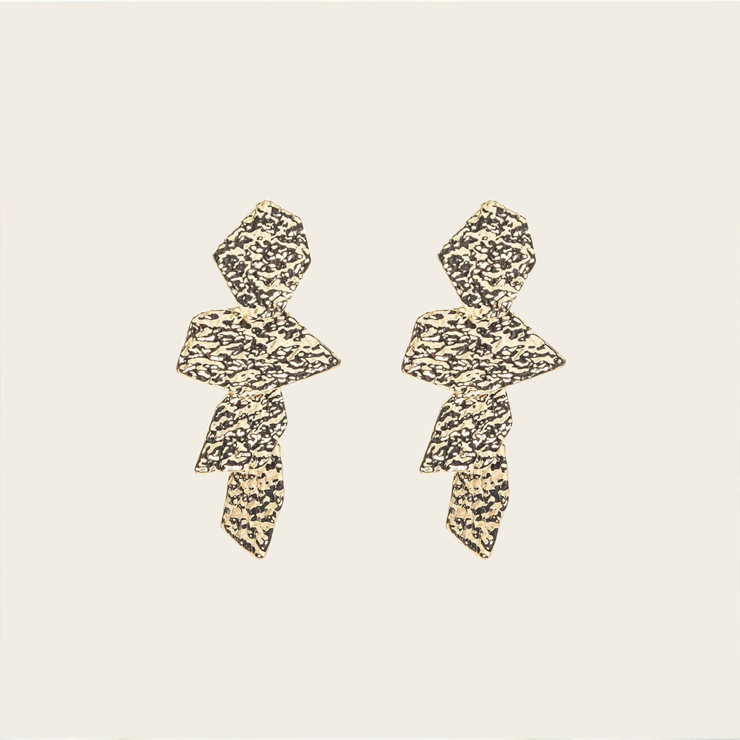 Image of the Manhattan Drop Clip On Earrings in Gold provide a secure and comfortable fit for any ear type. The padded clip-on design features a zinc and copper alloy construction, and lasts approximately 8-12 hours. As the earring pairs are non-adjustable, each purchase contains a single pair.