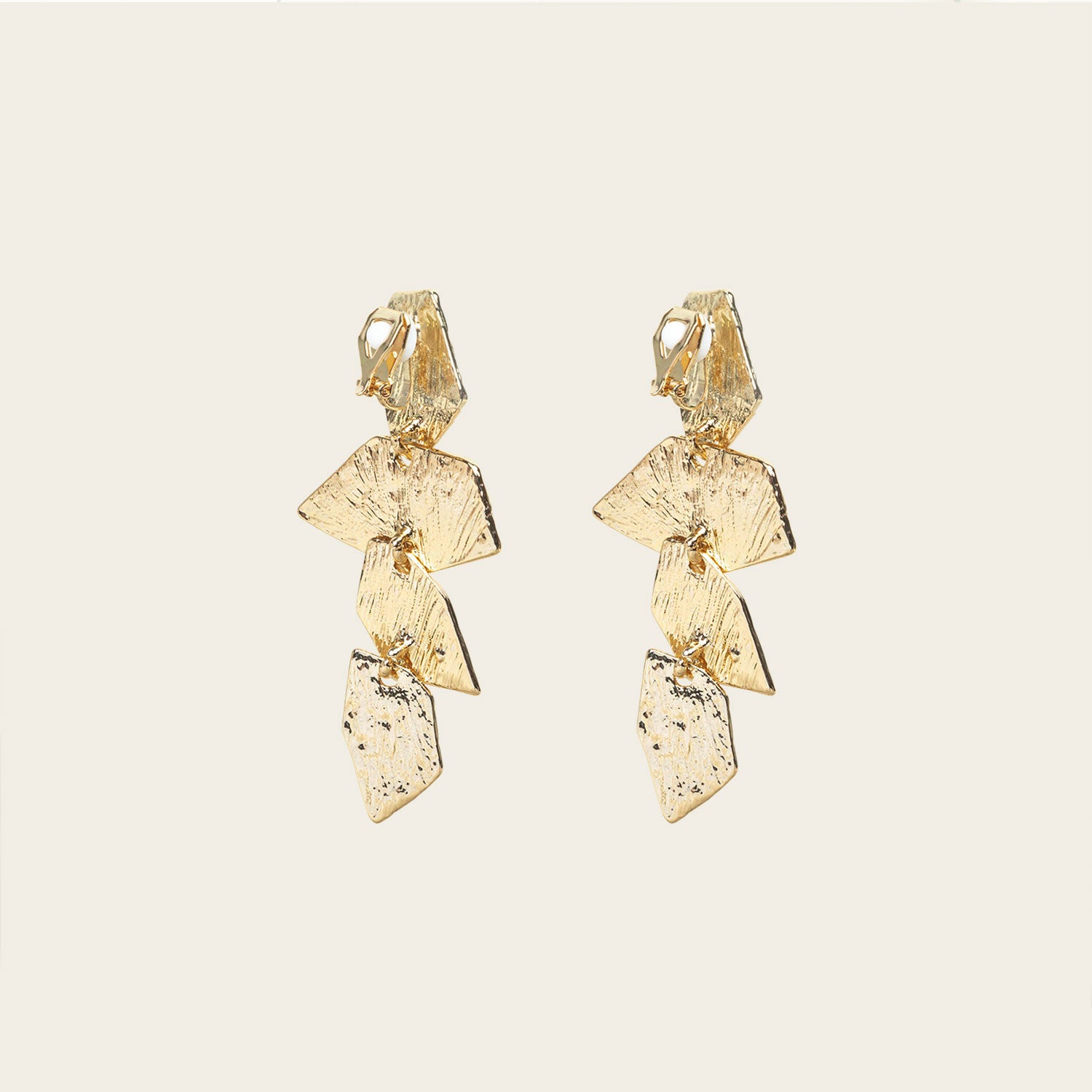 Image of the Manhattan Drop Clip On Earrings in Gold provide a secure and comfortable fit for any ear type. The padded clip-on design features a zinc and copper alloy construction, and lasts approximately 8-12 hours. As the earring pairs are non-adjustable, each purchase contains a single pair.