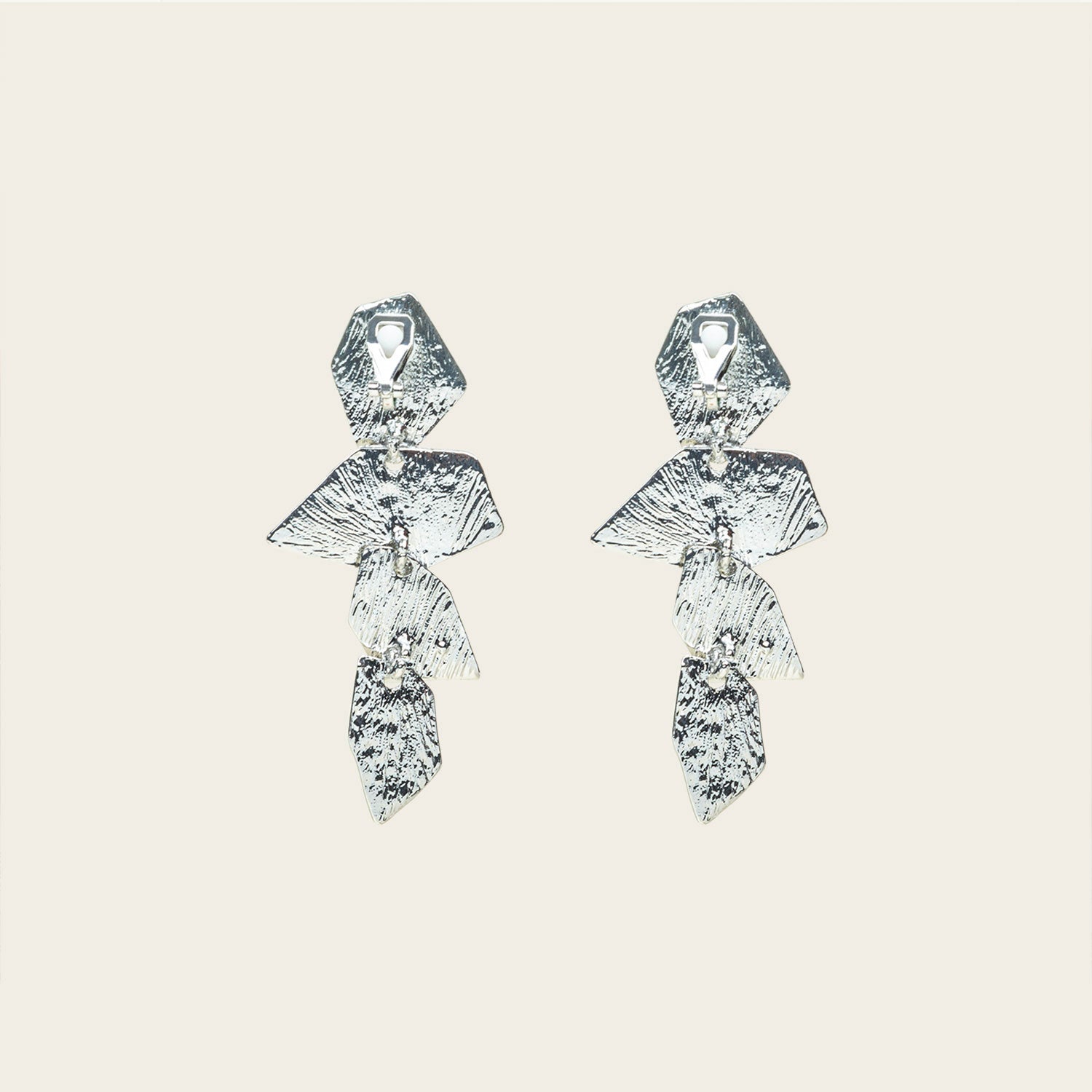 Image of the Manhattan Drop Clip On Earrings in Silver provide a secure and comfortable fit for any ear type. The padded clip-on design features a zinc and copper alloy construction, and lasts approximately 8-12 hours. As the earring pairs are non-adjustable, each purchase contains a single pair.