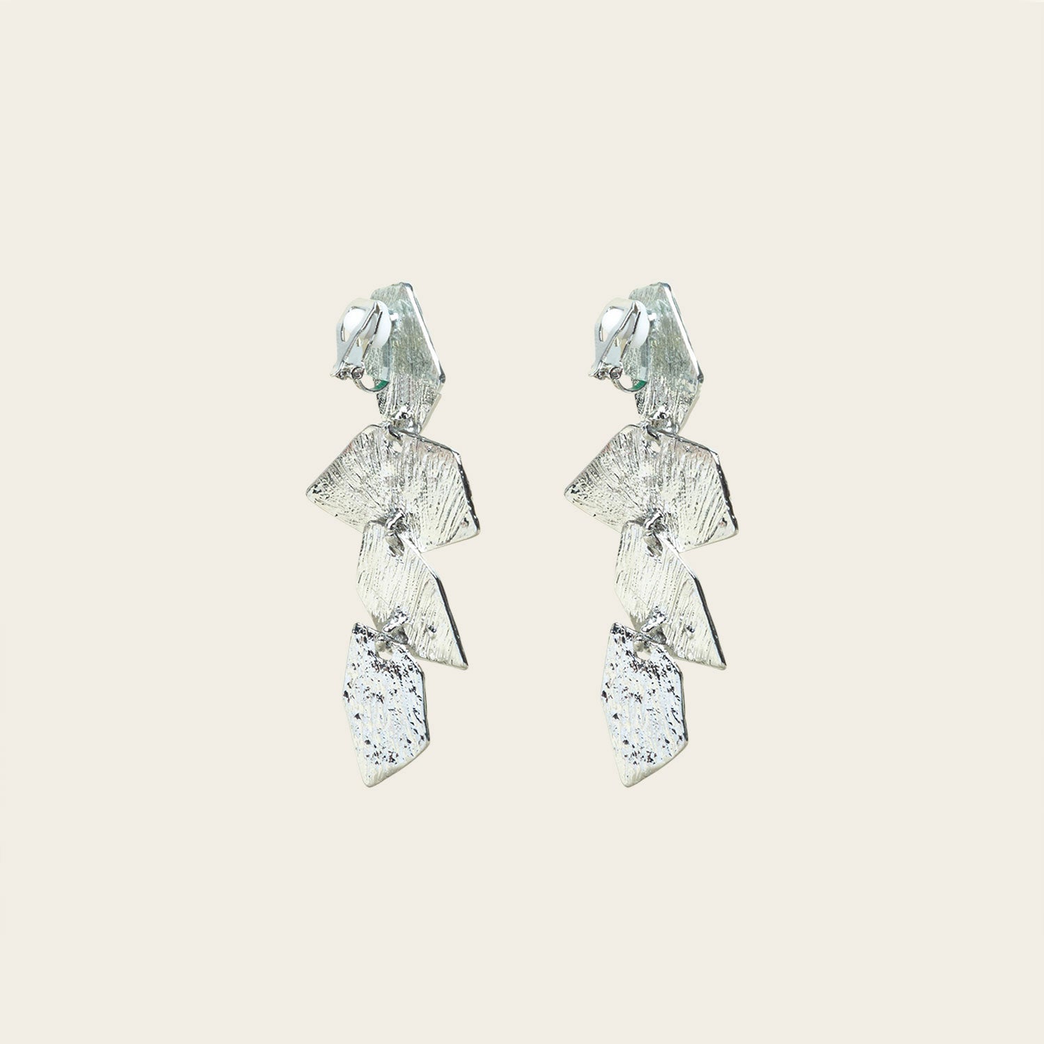 Image of the Manhattan Drop Clip On Earrings in Silver provide a secure and comfortable fit for any ear type. The padded clip-on design features a zinc and copper alloy construction, and lasts approximately 8-12 hours. As the earring pairs are non-adjustable, each purchase contains a single pair.