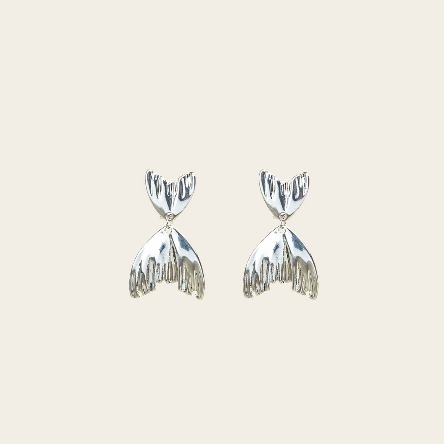 Image of the Mermaid Tail Clip On Earrings crafted in Silver Tone Zinc Alloy provide a secure hold for 8 to 12 hours. Padded Clip-On style is ideal for all ear types, and the earrings come as one pair with removable rubber padding. No adjustments possible.
