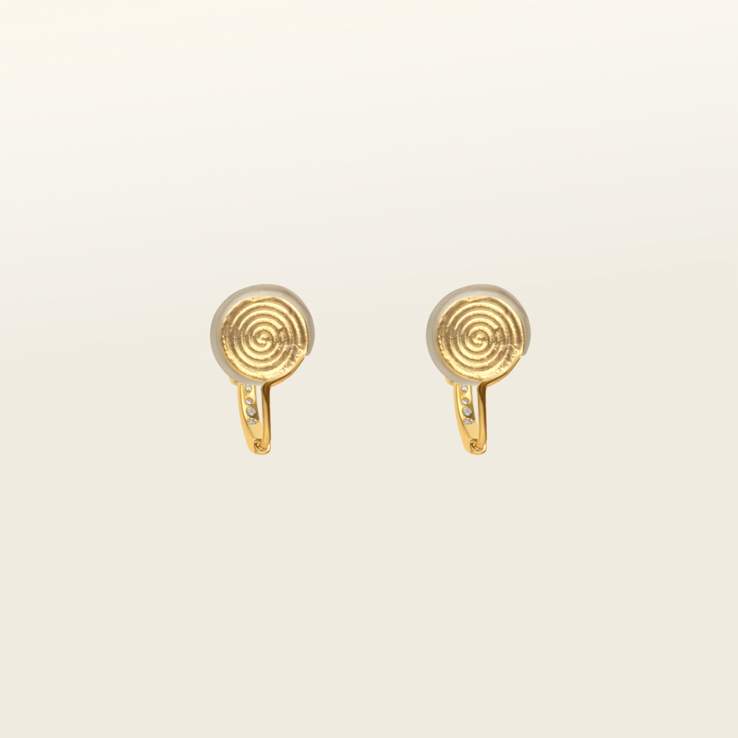 Catalogue Image of the Mini Pavé Huggie Clip-On Earrings - 14k gold-plated alloy with cubic zirconia, non-tarnish, water-resistant, and discreet mosquito coil closure for a regal touch.