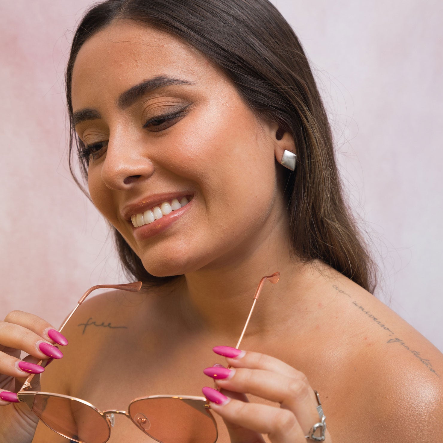 A model wearing the Negroni Clip On Earrings feature a Mosquito Coil Clip-On design, making them suitable for all ear types. Keep them on for up to 24 hours without discomfort, thanks to medium-strength secure hold and adjustable padding. Crafted from a Silver Toned Copper Alloy, each purchase contains one pair.