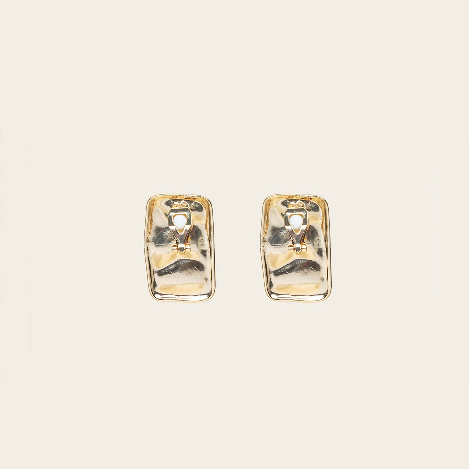 Image of the Nova Clip On Earrings in Gold feature a secure and comfortable padded clip-on design, suitable for all ear types. The earrings are crafted with Gold Tone Copper Alloy and offer an average comfortable wear duration of 8-12 hours. The design of the earring does not allow for adjustment, and each item sold is a single pair.
