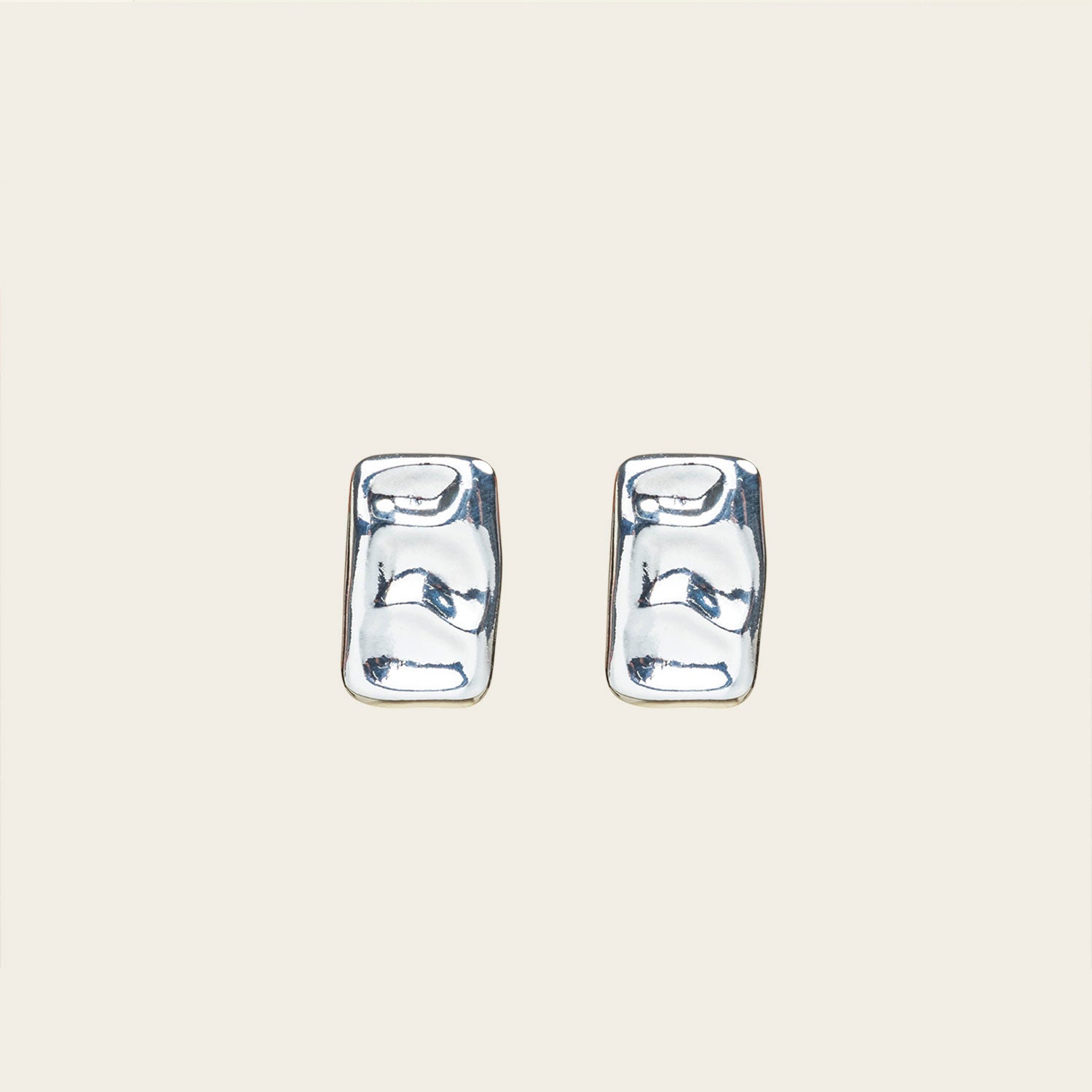 Image of the Nova Clip On Earrings in Silver feature a padded clip-on closure and are suitable for all ear types, including thick/large ears, thin/small ears, and even ears that are healing or stretched. Expect a secure and comfortable hold for 8 - 12 hours. Crafted using a silver tone copper alloy, this piece contains one pair of removable rubber-padded clip-on earrings.