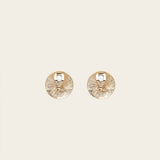 Image of the Paloma Clip-On Earrings in Gold provide a secure fit that is perfect for all ear types, including thick/large ears, sensitive ears, small/ thin ears, and stretched/healing ears. These earrings are crafted with a copper alloy and are free of lead and nickel. Their removable rubber padding ensures comfortable wear for up to 12 hours. This package contains one pair of earrings.