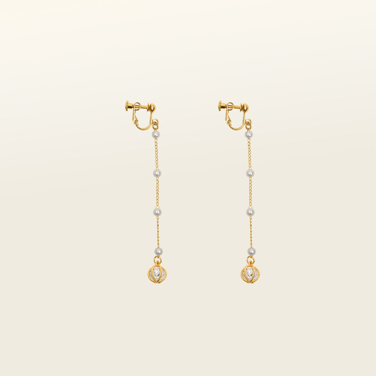 Image of the Pearl Drop Clip-On Earrings features a secure screw-back closure. Compatible with all ear types, these earrings provide a comfortable wear of 8-12 hours and offer an adjustable hold strength. Constructed with gold-tone plated metal alloy and a faux pearl, this single pair of earrings is sure to become a favorite.