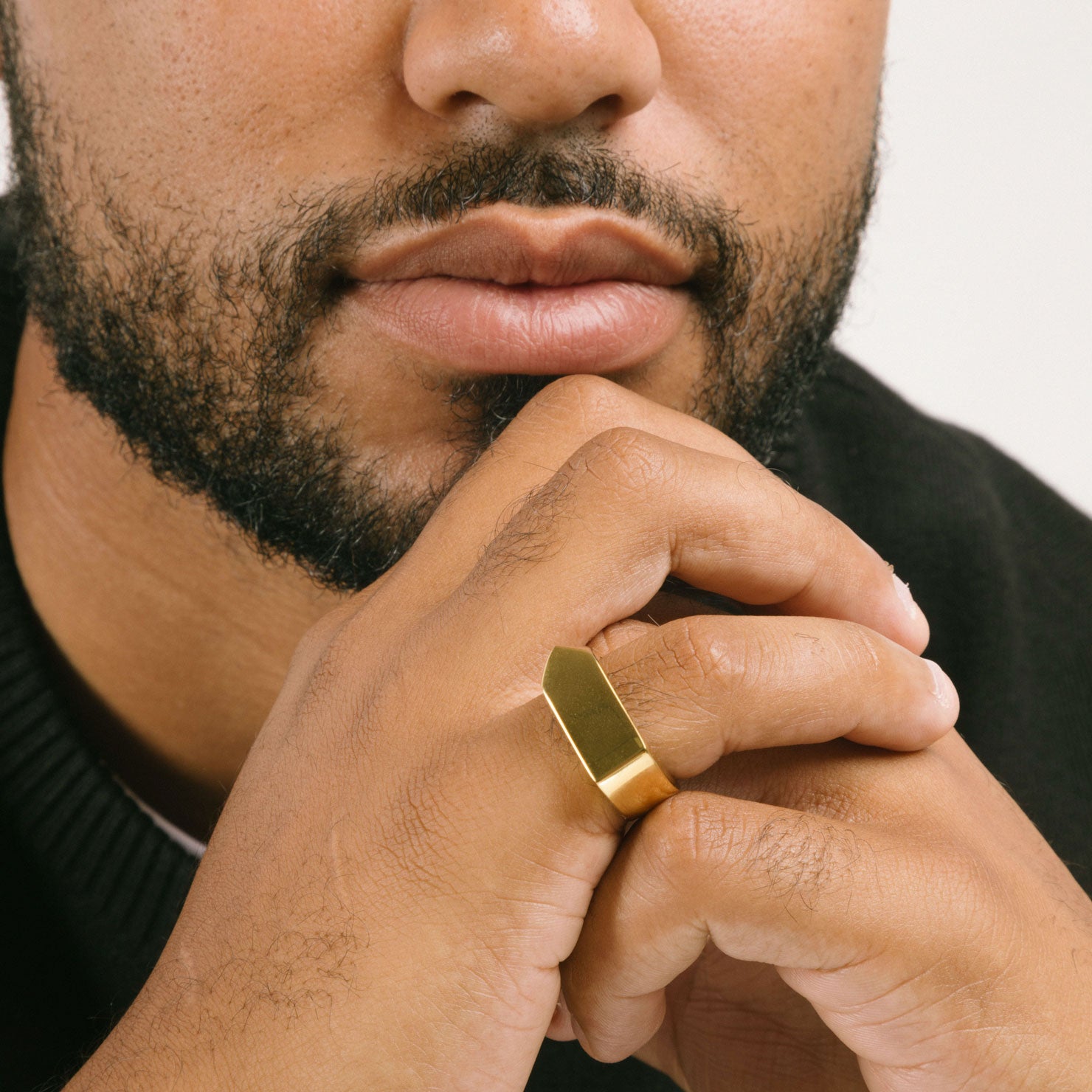 A model wearing the Pointed Band Ring is crafted in 18K Gold Plating to give it a luxurious look and feel. Measuring 8mm in width, its durable and non-tarnish finish makes this an ideal accessory for everyday wear. Water-resistant for added protection.