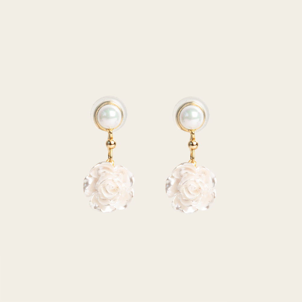 Image of the Rosemary Clip On Earrings. These earrings provide a secure hold for up to 24 hours and are easily adjustable for all ear types. Elevate your style without sacrificing comfort with these must-have accessories.