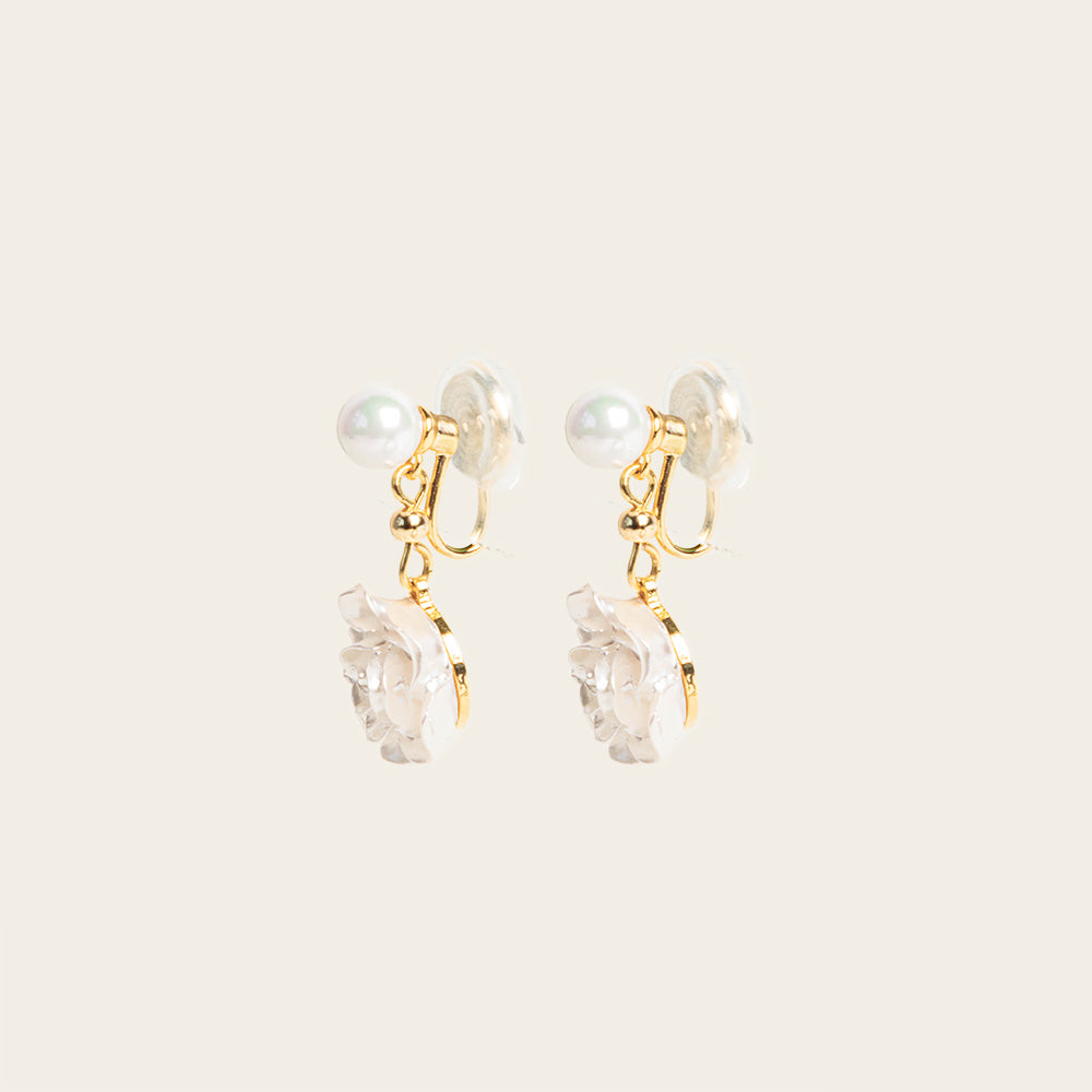 Image of the Rosemary Clip On Earrings. These earrings provide a secure hold for up to 24 hours and are easily adjustable for all ear types. Elevate your style without sacrificing comfort with these must-have accessories.