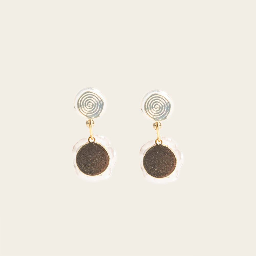 Image of the Rosemary Clip On Earrings. These earrings provide a secure hold for up to 24 hours and are easily adjustable for all ear types. Elevate your style without sacrificing comfort with these must-have accessories.