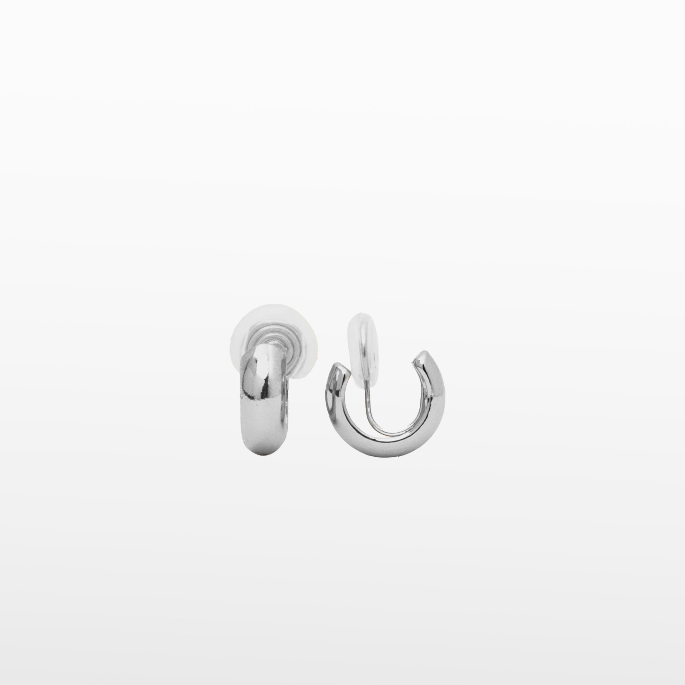 Image of the Small Hoop Clip-On Earrings in Silver offer medium-secure hold for up to 24 hours. Crafted from copper alloy, they feature a mosquito coil closure and can be adjusted to fit various ear types. One pair per order.