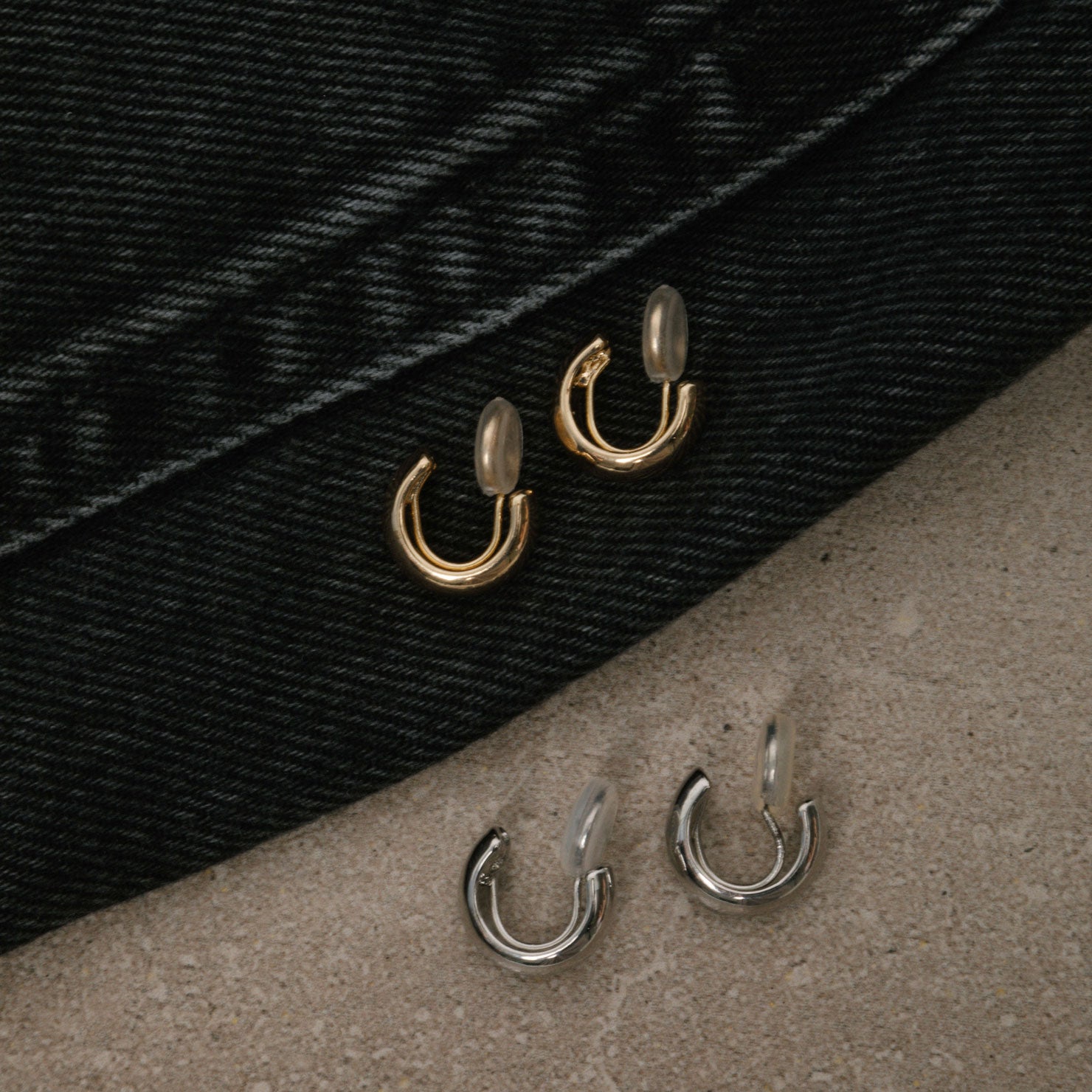 Image of the Small Hoop Clip-On Earrings in Silver offer medium-secure hold for up to 24 hours. Crafted from copper alloy, they feature a mosquito coil closure and can be adjusted to fit various ear types. One pair per order.