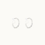 Image of the Smith Hoop Clip On Earrings in Silver, perfect for all ear sizes. With a resin clip-on closure and medium secure hold, these earrings provide comfort for 8-12 hours. Whether you have thick, large, or sensitive ears, these earrings are a must-have! Note: No adjustments possible and one pair only.