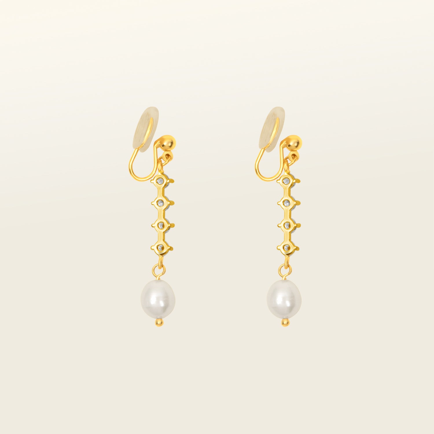 Image of the Sophia Clip On Earrings are designed for thick/large ears and sensitive ears alike. These earrings feature mosquito coil clip-on closures with a 24-hour average comfortable wear duration. Their medium secure hold can be adjusted gently by squeezing the padding forward once on the ear. Crafted with 14K gold plating, simulated faux pearl, and cubic zirconia, these earrings are lead/nickel/cadmium free and sold in single pairs.