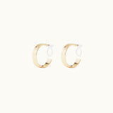 Image of the Speckled Hoop Clip On Earrings in Gold offer versatility and comfort for a range of ear sizes and sensitivities. With a medium secure hold, you can confidently wear them for 8-12 hours. Sold as a pair.