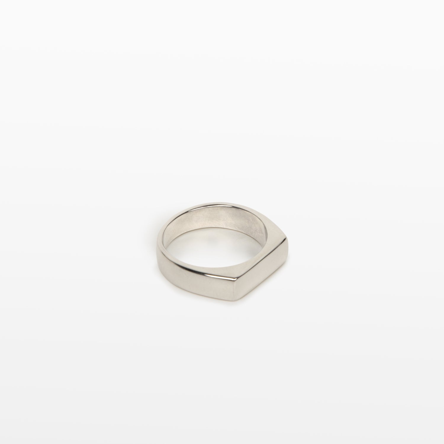 Image of the Straight Band Ring in Silver crafted from Stainless Steel, measuring 4mm in width, and featuring non-tarnish and water-resistant properties.