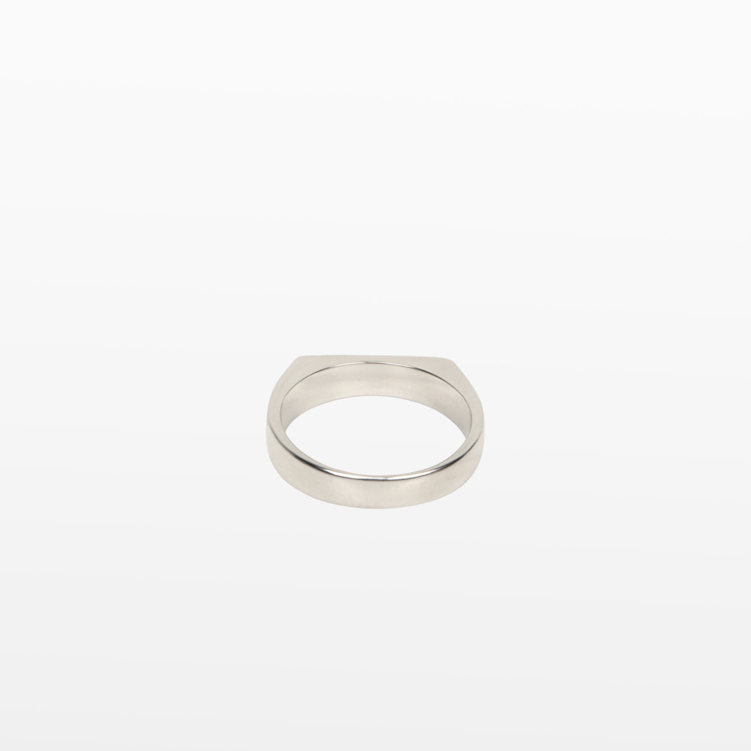 Image of the Straight Band Ring in Silver crafted from Stainless Steel, measuring 4mm in width, and featuring non-tarnish and water-resistant properties.