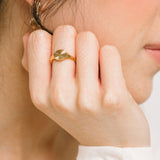 A model wearing the Sunbeam Ring is crafted out of 18K Gold Plated Stainless Steel, providing a non-tarnishing and water-resistant material. Please note, this ring is sold as a single item.