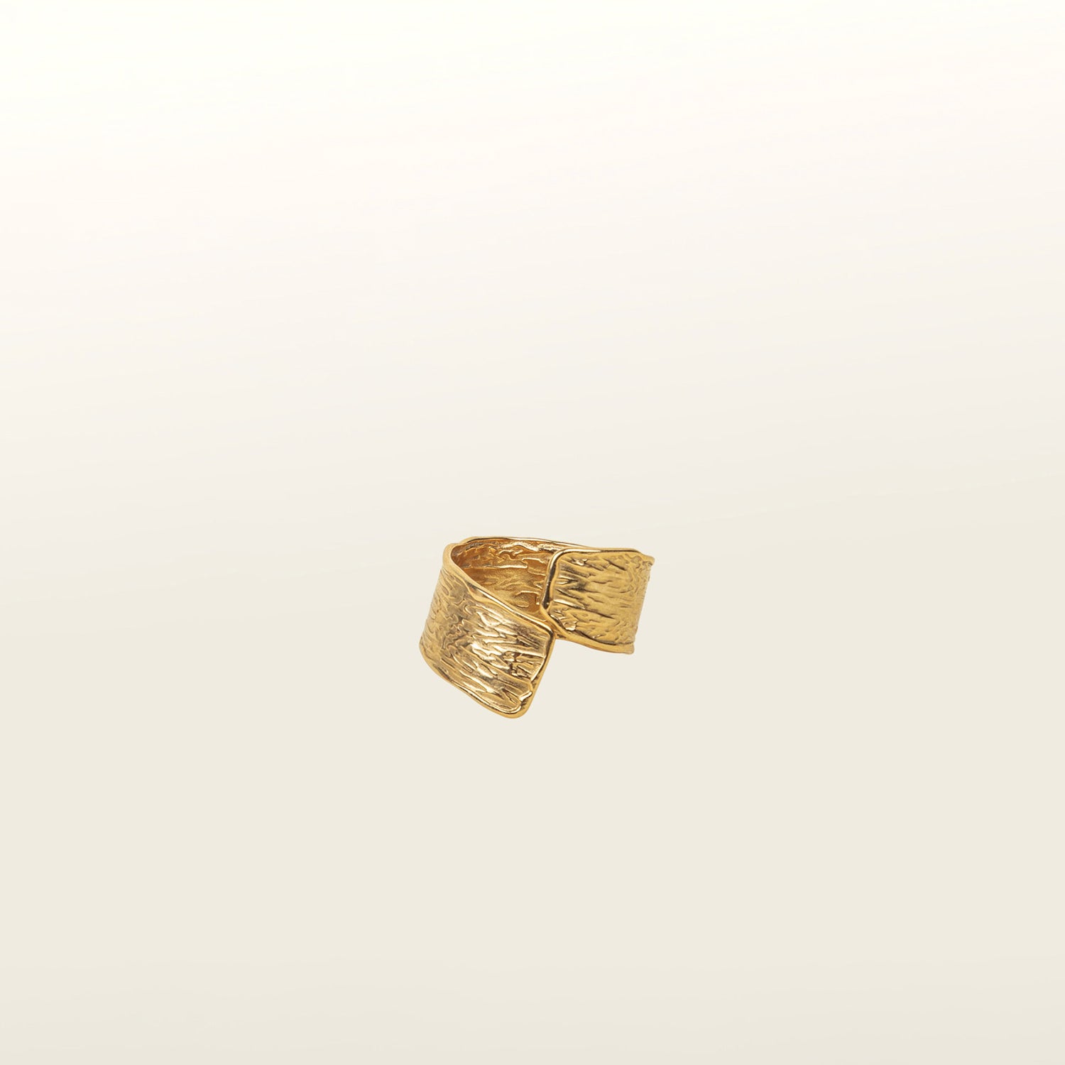 Image of the Textured Curl Ring in Gold is adjustable between sizes 7-10, crafted using 14K Gold Plated Stainless Steel for durability and resistance to tarnish, water, and lead, nickel, and cadmium. Please note that only one ring is included.