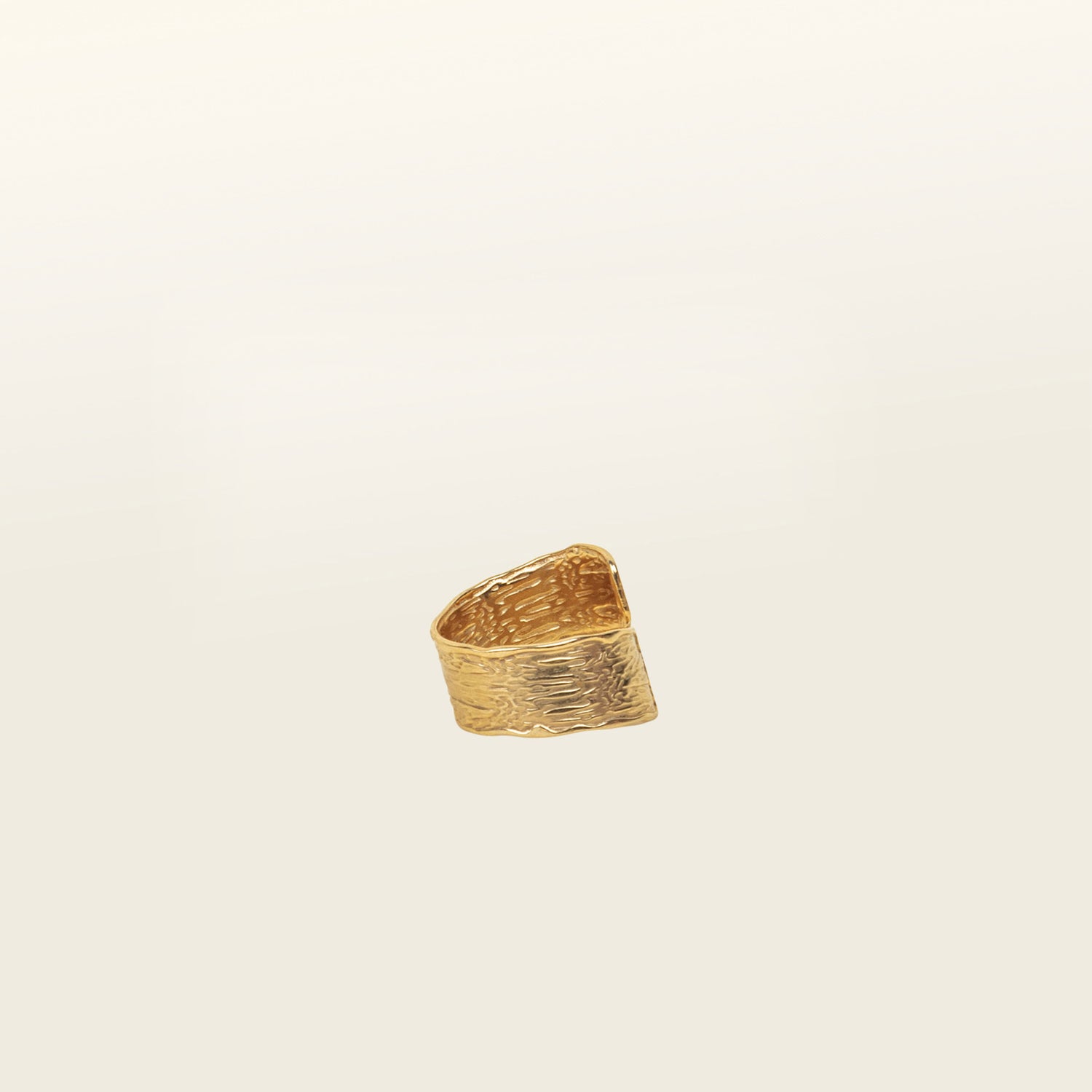 Image of the Textured Curl Ring in Gold is adjustable between sizes 7-10, crafted using 14K Gold Plated Stainless Steel for durability and resistance to tarnish, water, and lead, nickel, and cadmium. Please note that only one ring is included.