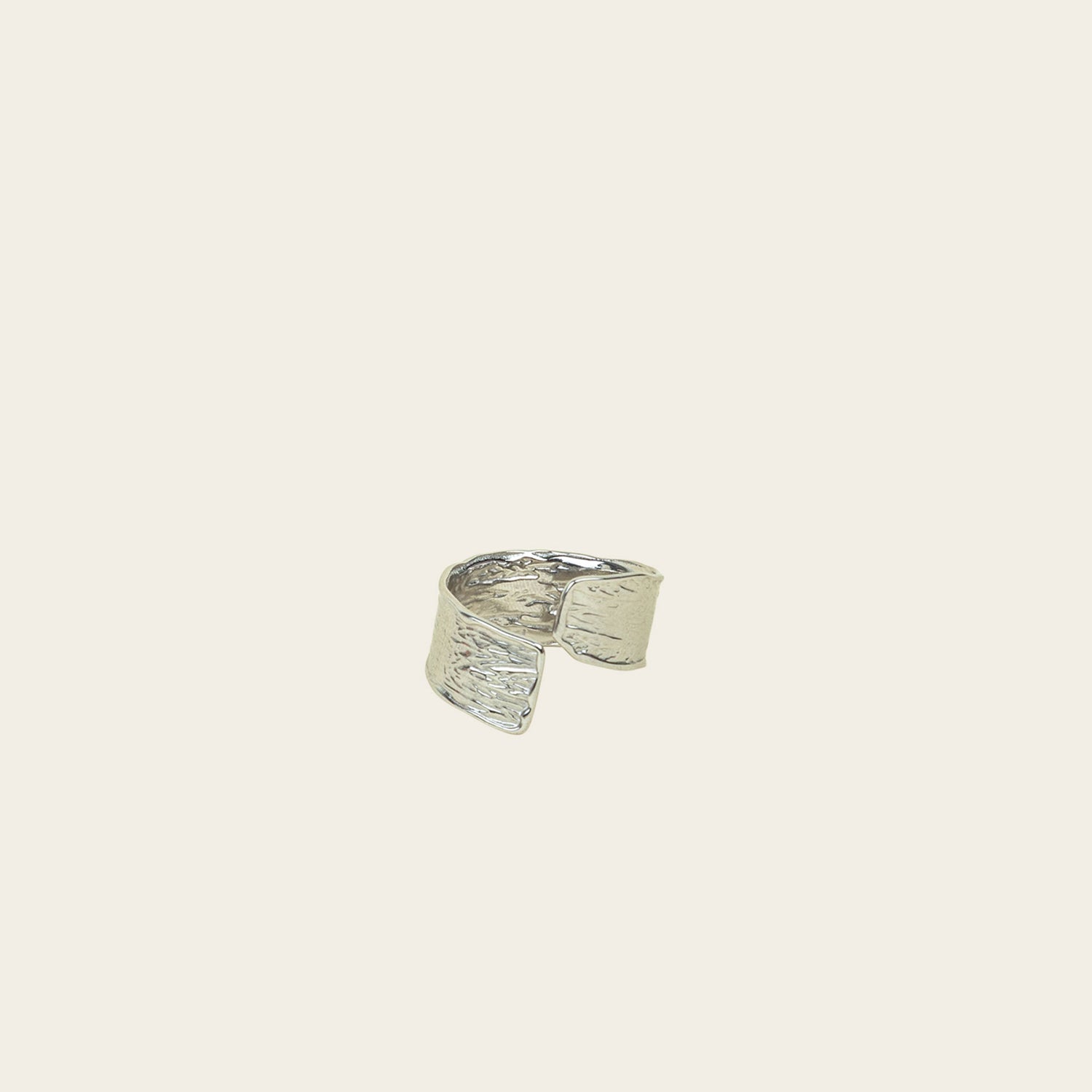 Image of the Textured Curl Ring in Silver offers adjustable sizing between 7-10, while crafted with stainless steel for long-lasting use. It is also water-resistant, non-tarnishing, and free of lead, nickel, and cadmium. Note: this is a single ring.