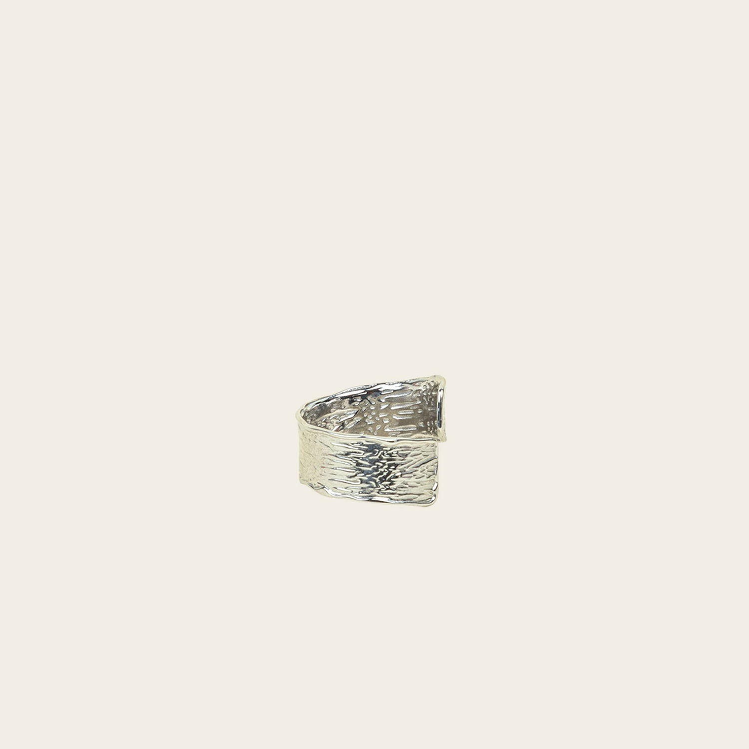 Image of the Textured Curl Ring in Silver offers adjustable sizing between 7-10, while crafted with stainless steel for long-lasting use. It is also water-resistant, non-tarnishing, and free of lead, nickel, and cadmium. Note: this is a single ring.