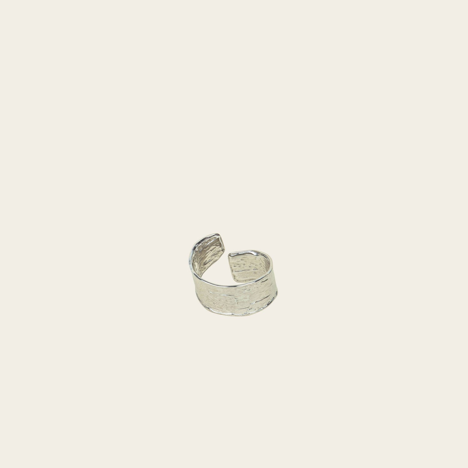 Image of the Textured Curl Ring in Silver offers adjustable sizing between 7-10, while crafted with stainless steel for long-lasting use. It is also water-resistant, non-tarnishing, and free of lead, nickel, and cadmium. Note: this is a single ring.