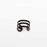 Image of the Triple Band Ear Cuff features a secure medium hold, adjustable fit, and non-tarnish, water-resistant stainless steel and titanium construction. Its 9mm diameter and 6mm width makes it ideal for all ear types, including thick/large, sensitive, small/thin, and stretched/healing ears. Average comfortable wear duration is up to 24 hours for one piece. Intended to be worn on the helix of the ear.