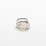Image of the Triple Band Ear Cuff features a secure medium hold, adjustable fit, and non-tarnish, water-resistant stainless steel and titanium construction. Its 9mm diameter and 6mm width makes it ideal for all ear types, including thick/large, sensitive, small/thin, and stretched/healing ears. Average comfortable wear duration is up to 24 hours for one piece. Intended to be worn on the helix of the ear.