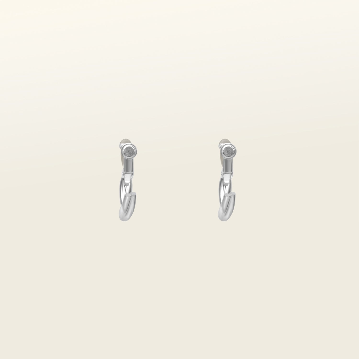 Image of the Twist Hoop Earrings feature a secure and comfortable screwback clip-on closure ideal for all ear types. Wear these earrings for up to 8-12 hours per day with a secure hold and the ability to be manually adjusted to the individual's size. Crafted from gold tone plated copper alloy, these earrings come is a single pair.