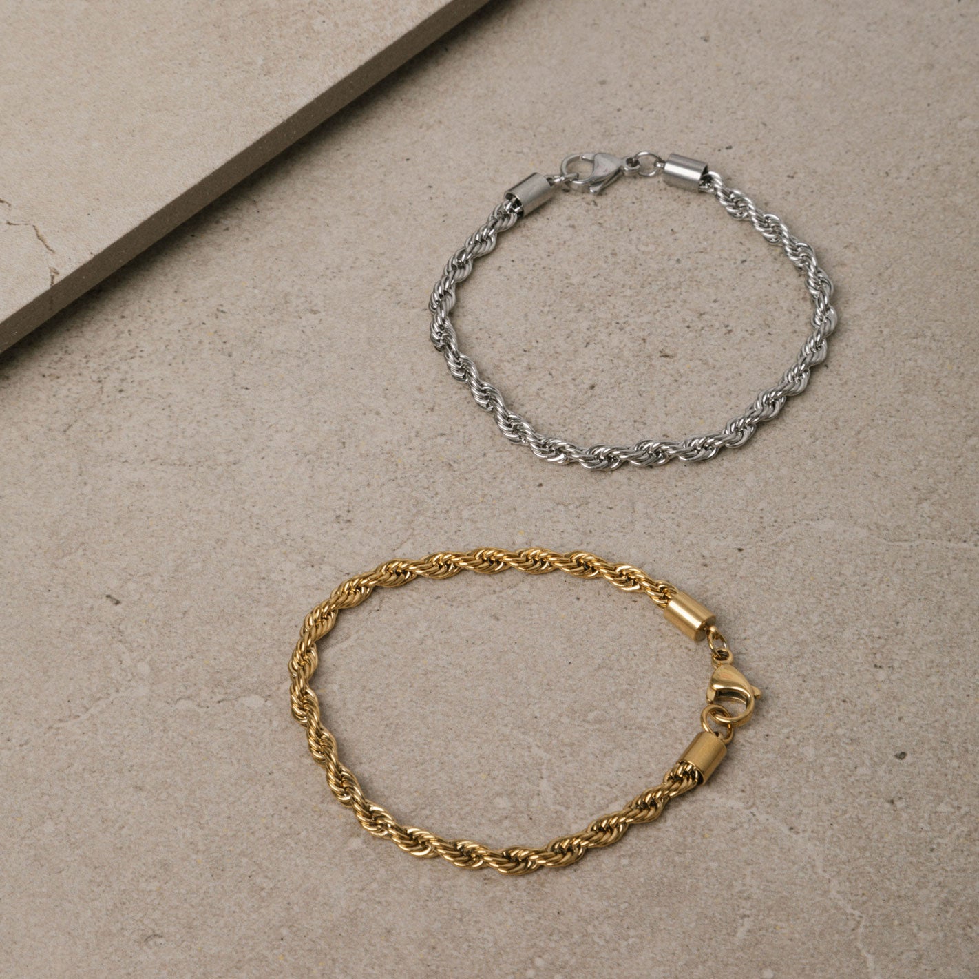 Image of the Twist Rope Chain Bracelet in Gold is crafted with high-quality 18K Gold plating, and features a length of 18cm and width of 4mm. Enjoy the additional benefits of its non-tarnish and water-resistant properties.