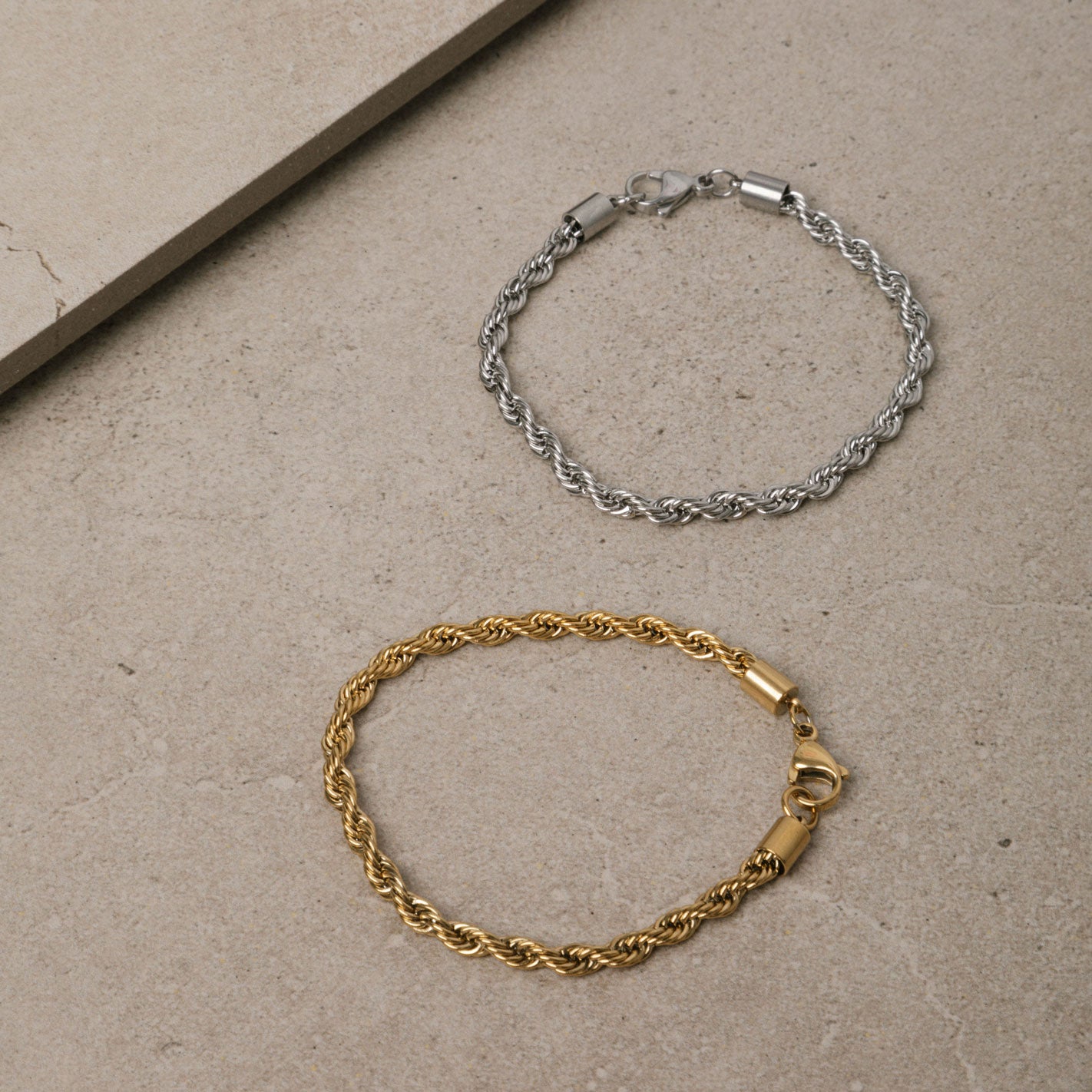 Image of the Twist Rope Chain Bracelet in Silver is crafted from non-tarnish and water-resistant stainless steel, with dimensions of 18 cm in length and 4 mm in width.
