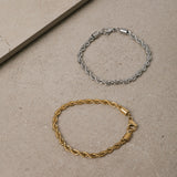 Image of the Twist Rope Chain Bracelet in Silver is crafted from non-tarnish and water-resistant stainless steel, with dimensions of 18 cm in length and 4 mm in width.